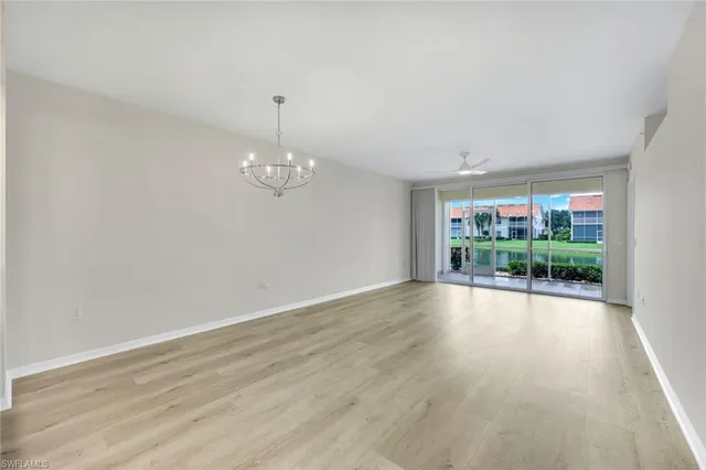 a view of a kitchen with a sink and cabinets