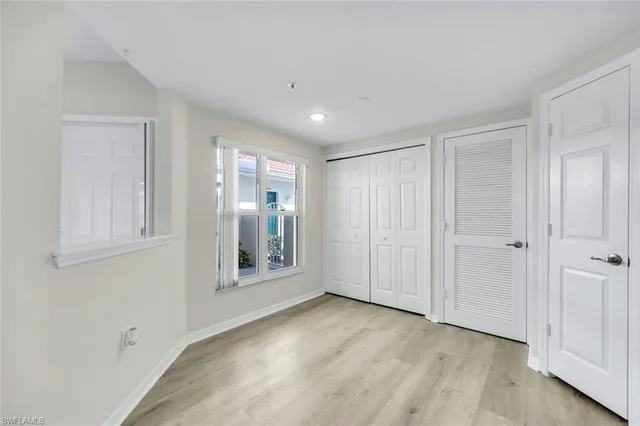 an aerial view of a house with a yard and lake view