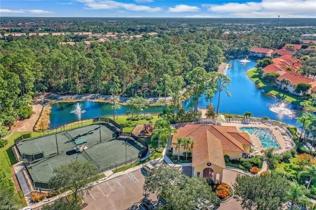 a view of a lake with houses in the background