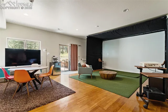 a large kitchen with a table and chairs
