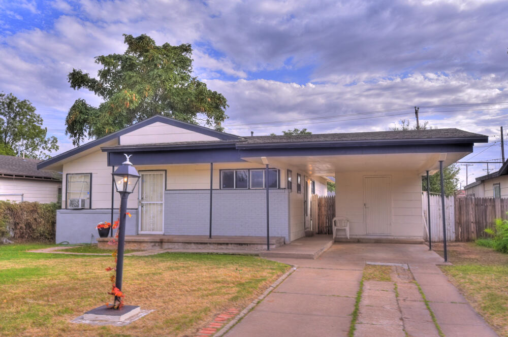 3013 2nd Street Lubbock, TX 79415 - Photo 1 of 21 a front view of a house with garden