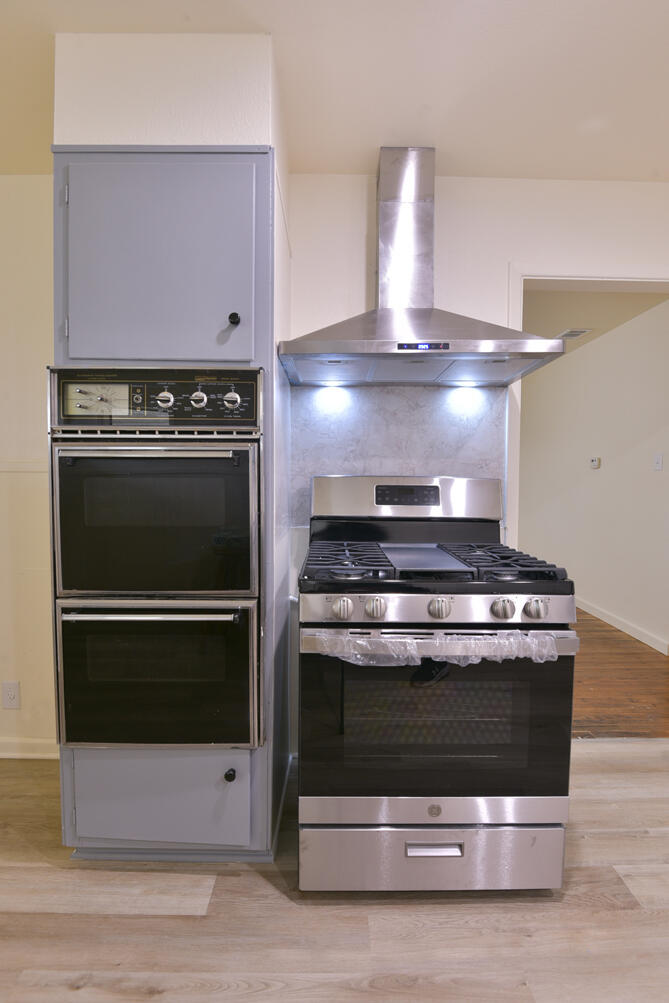 3013 2nd Street Lubbock, TX 79415 - Photo 12 of 21 a stove top oven sitting inside of a kitchen