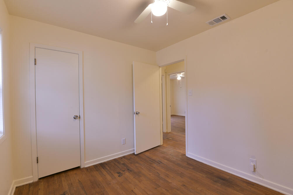 3013 2nd Street Lubbock, TX 79415 - Photo 15 of 21 a view of an empty room with wooden floor