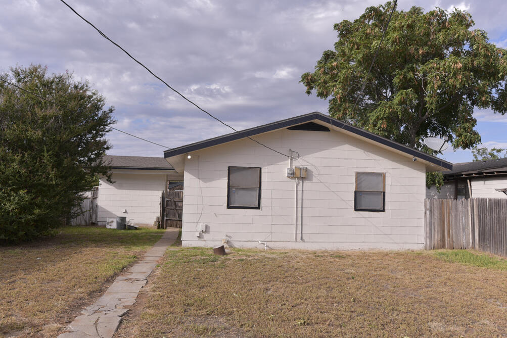 3013 2nd Street Lubbock, TX 79415 - Photo 21 of 21 a front view of a house with a yard and garage