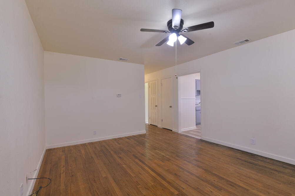 3013 2nd Street Lubbock, TX 79415 - Photo 3 of 21 wooden floor in an empty room
