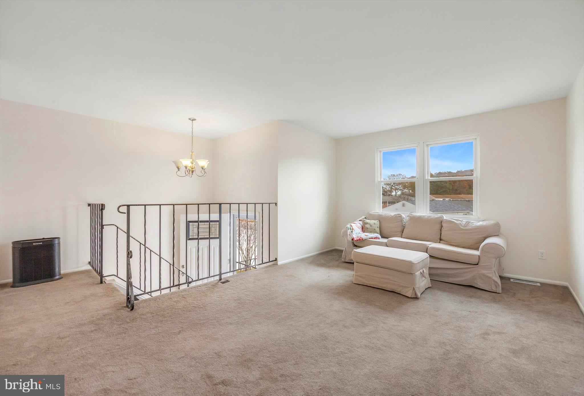 7740 Notley Road Pasadena, MD 21122 - Photo 11 of 46 a living room with furniture and a window
