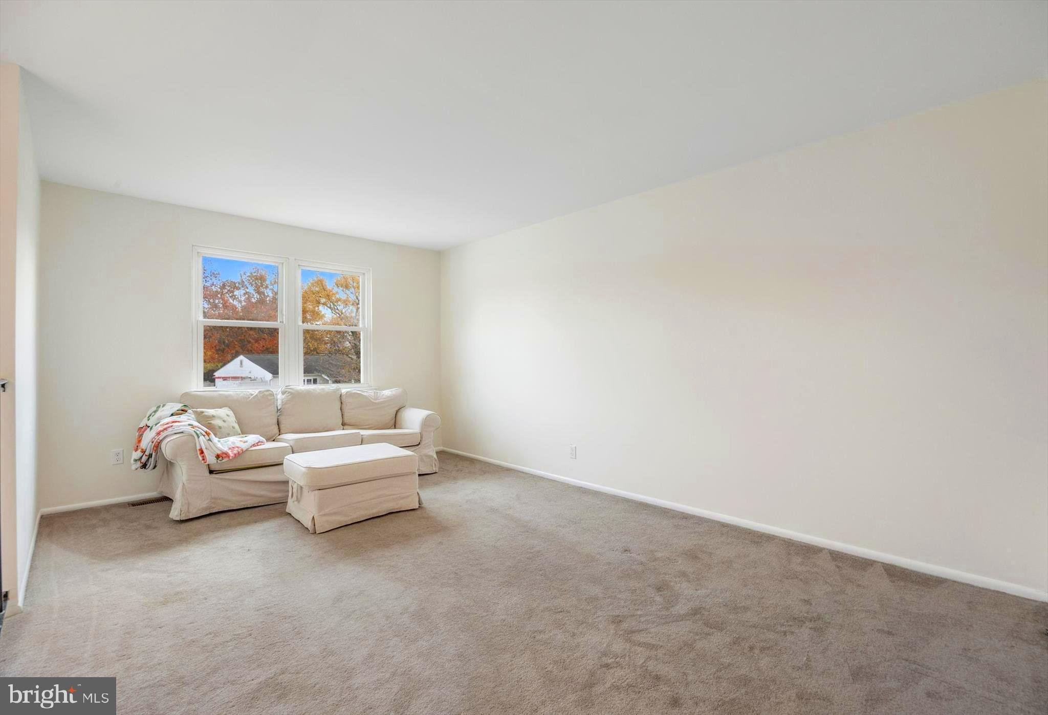 7740 Notley Road Pasadena, MD 21122 - Photo 13 of 46 a living room with furniture and a window