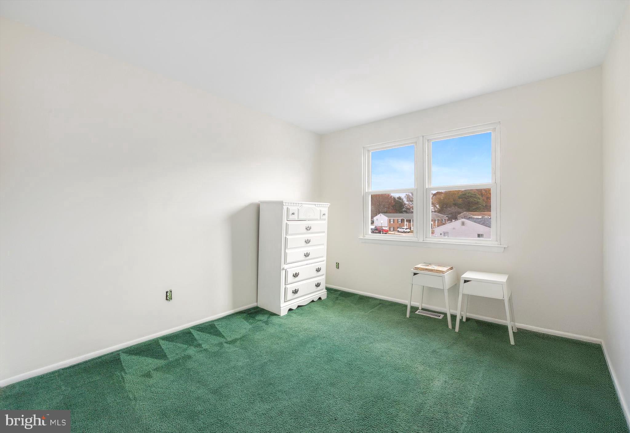 7740 Notley Road Pasadena, MD 21122 - Photo 18 of 46 a room with a window and a wooden floor