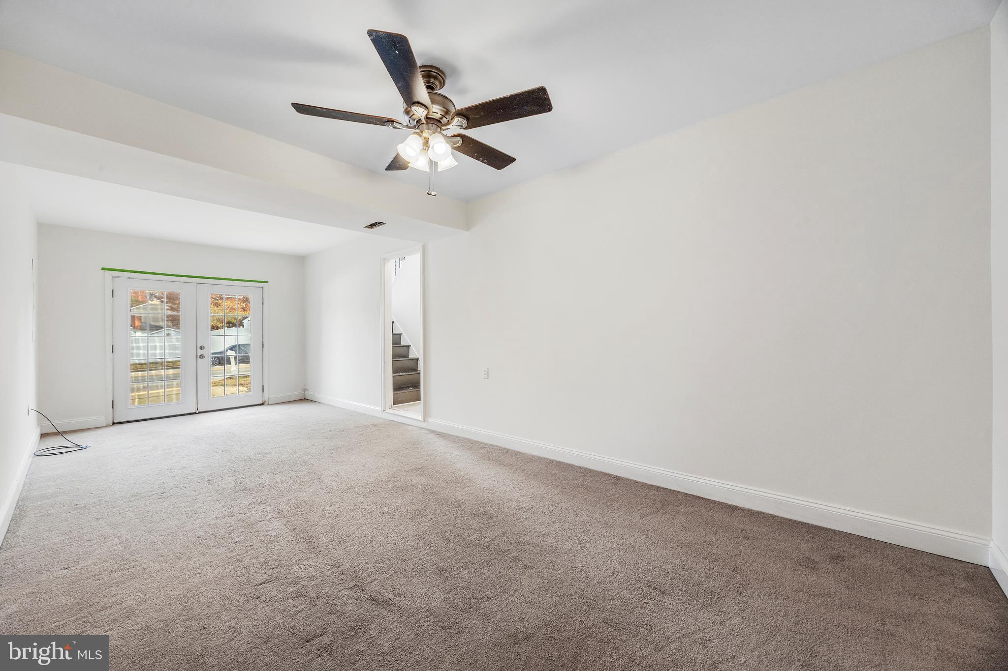 7740 Notley Road Pasadena, MD 21122 - Photo 24 of 46 an empty room with windows and fan