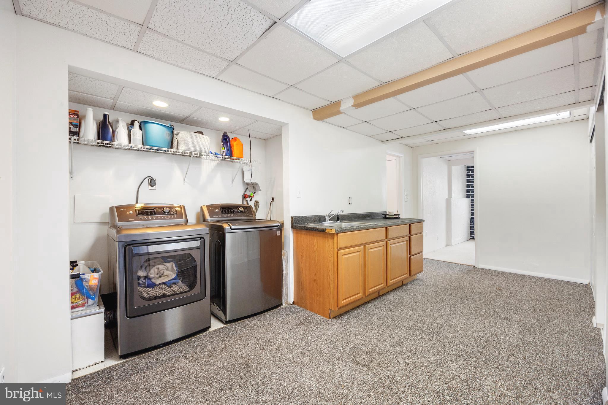 7740 Notley Road Pasadena, MD 21122 - Photo 26 of 46 a kitchen with stainless steel appliances granite countertop a stove a sink and a refrigerator