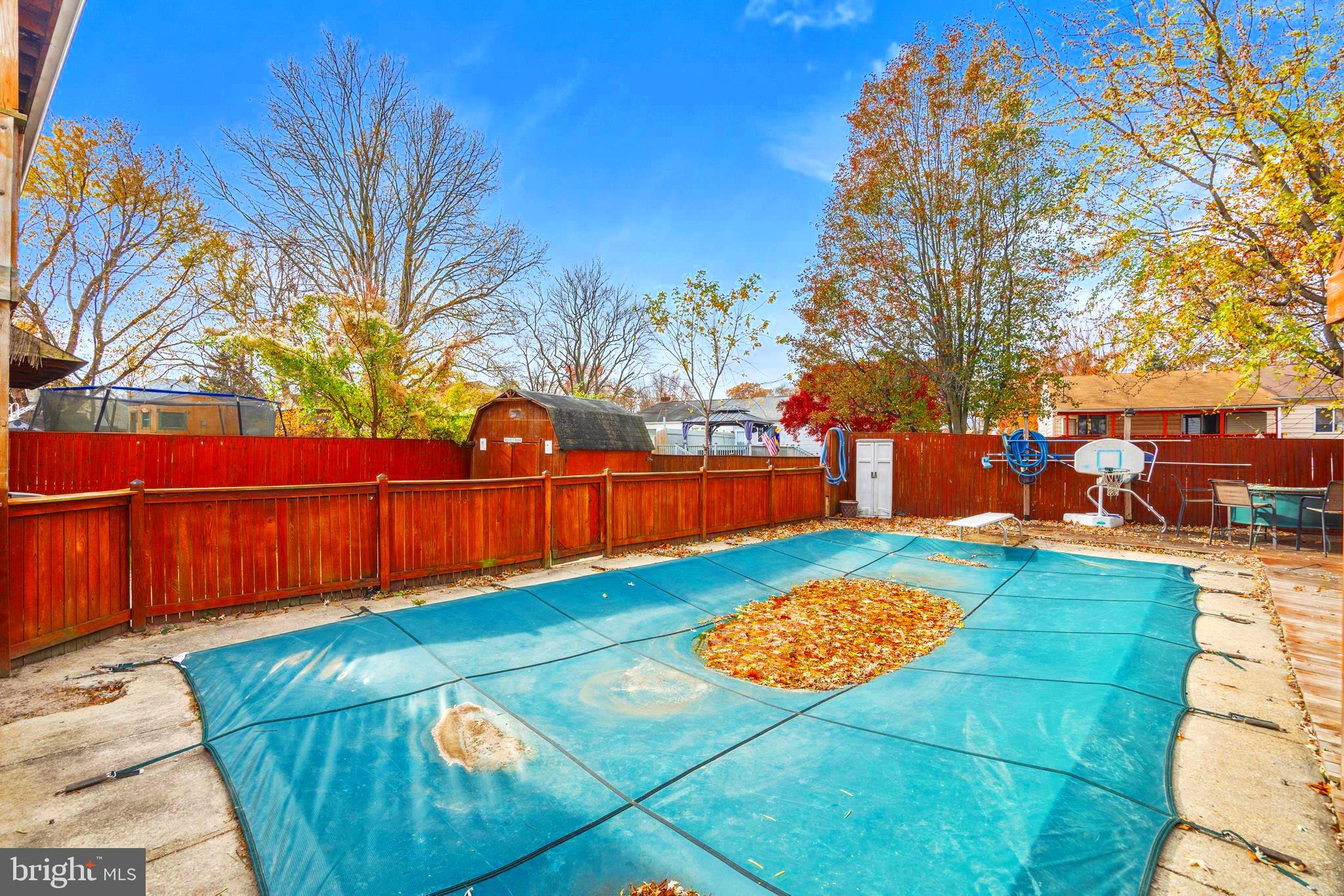 7740 Notley Road Pasadena, MD 21122 - Photo 34 of 46 a view of yard with swimming pool and trees