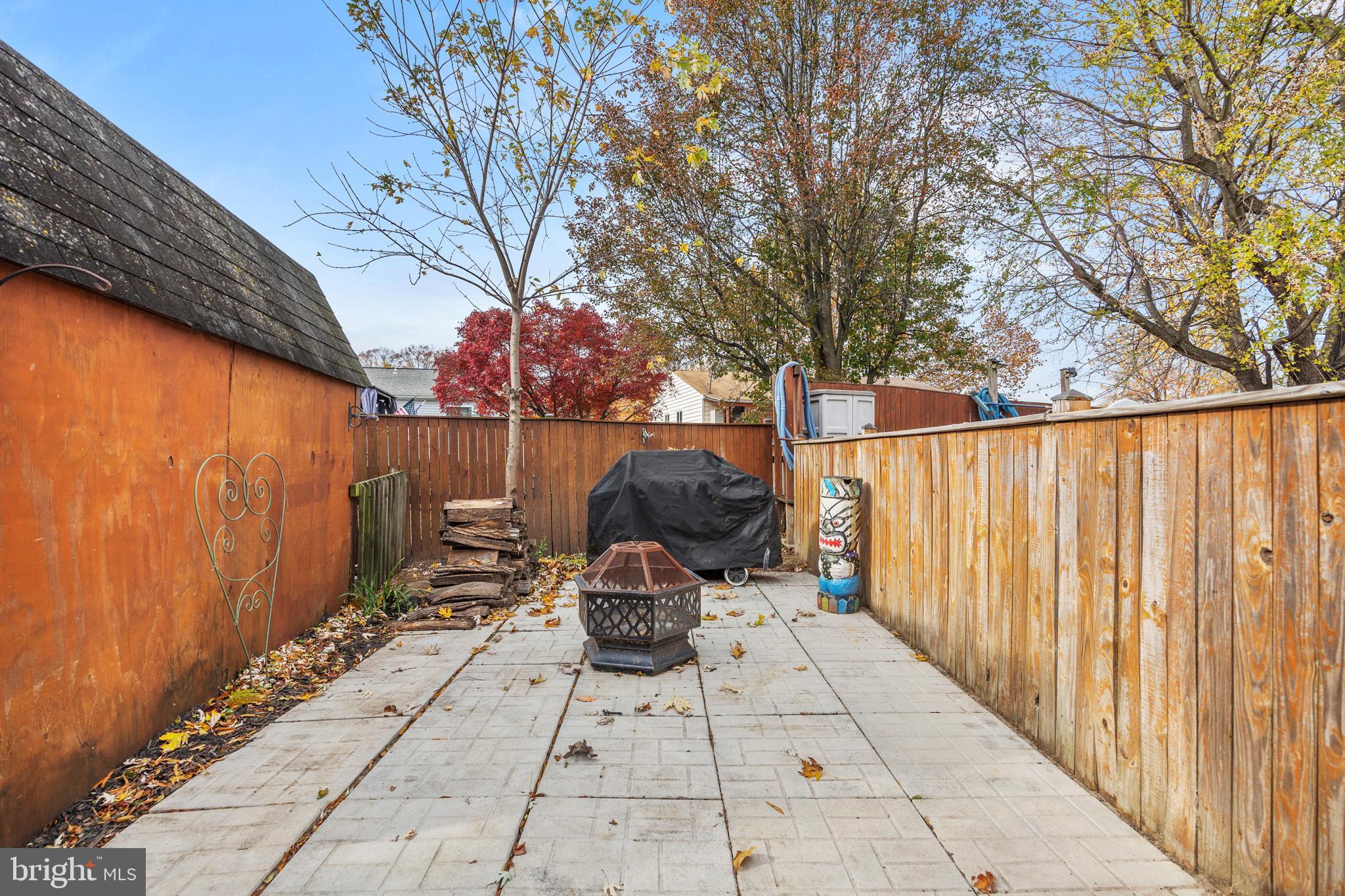 7740 Notley Road Pasadena, MD 21122 - Photo 37 of 46 a view of backyard with outdoor seating