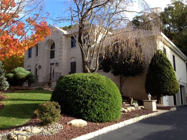 292 Nottingham Road Morganville, NJ 07751 - Photo 1 of 22 a front view of a house with a yard