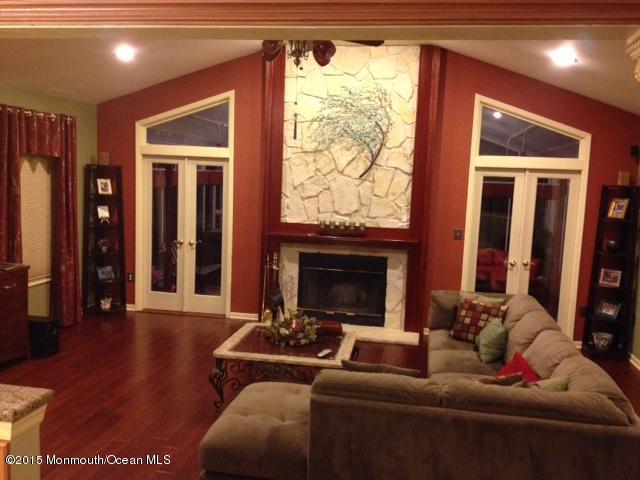 292 Nottingham Road Morganville, NJ 07751 - Photo 14 of 22 a living room with furniture and a fireplace