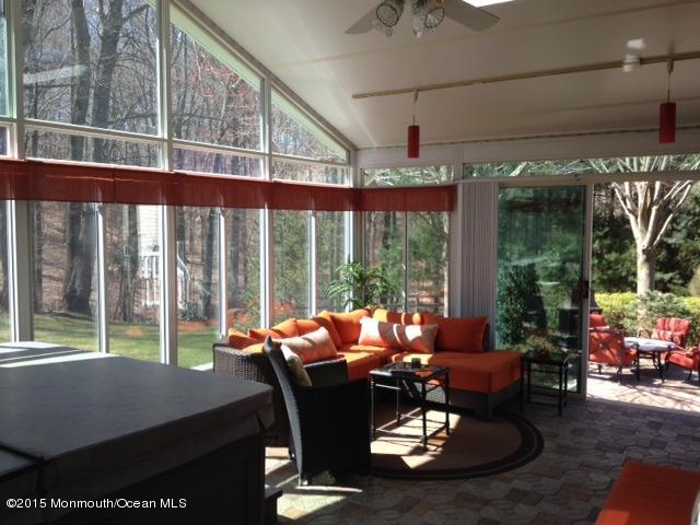 292 Nottingham Road Morganville, NJ 07751 - Photo 15 of 22 a living room with patio furniture and a floor to ceiling window