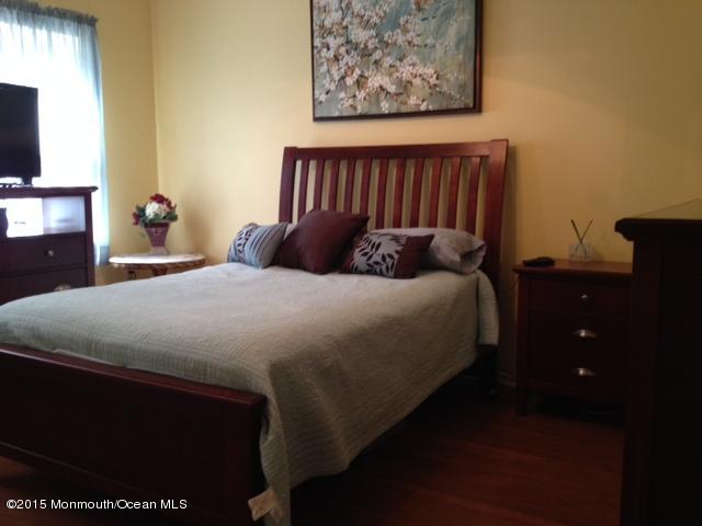 292 Nottingham Road Morganville, NJ 07751 - Photo 16 of 22 a bedroom with a bed and a television