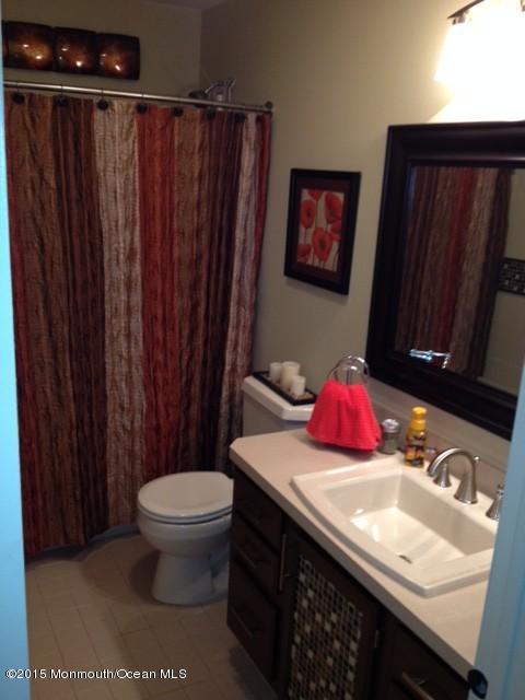 292 Nottingham Road Morganville, NJ 07751 - Photo 17 of 22 a bathroom with a sink and a toilet