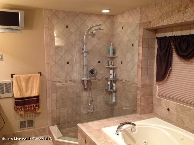 292 Nottingham Road Morganville, NJ 07751 - Photo 19 of 22 a bathroom with a sink and a mirror