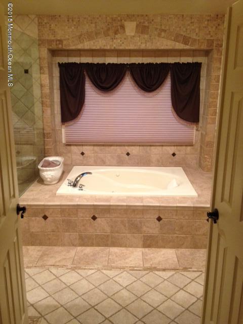 292 Nottingham Road Morganville, NJ 07751 - Photo 20 of 22 a bathroom with a sink and a mirror