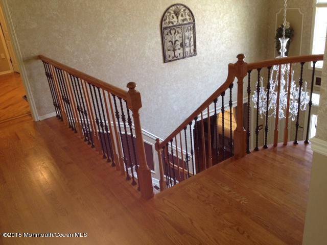 292 Nottingham Road Morganville, NJ 07751 - Photo 6 of 22 a view of a hallway with wooden floor