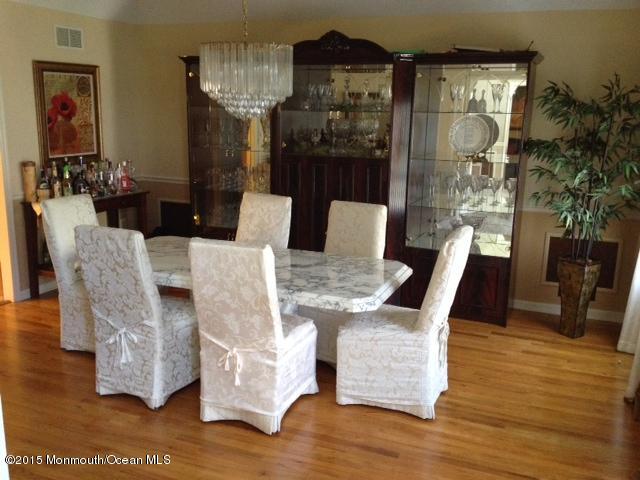 292 Nottingham Road Morganville, NJ 07751 - Photo 8 of 22 a view of a dining room with furniture window and wooden floor