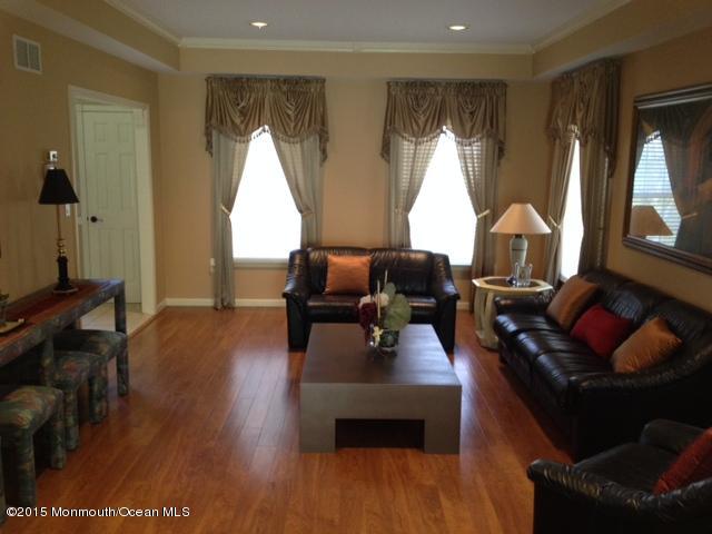 292 Nottingham Road Morganville, NJ 07751 - Photo 9 of 22 a living room with furniture and a large window