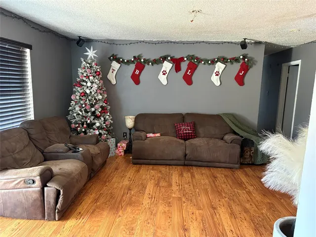 a kitchen with stainless steel appliances granite countertop a refrigerator and a stove