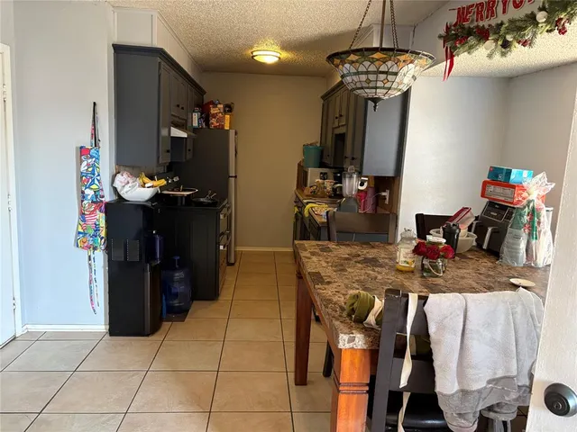 a view of a dining room with furniture and window