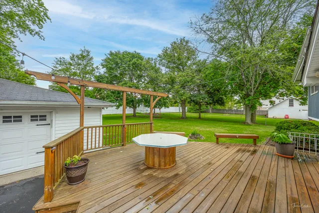 a view of a chair and table on the wooden floor