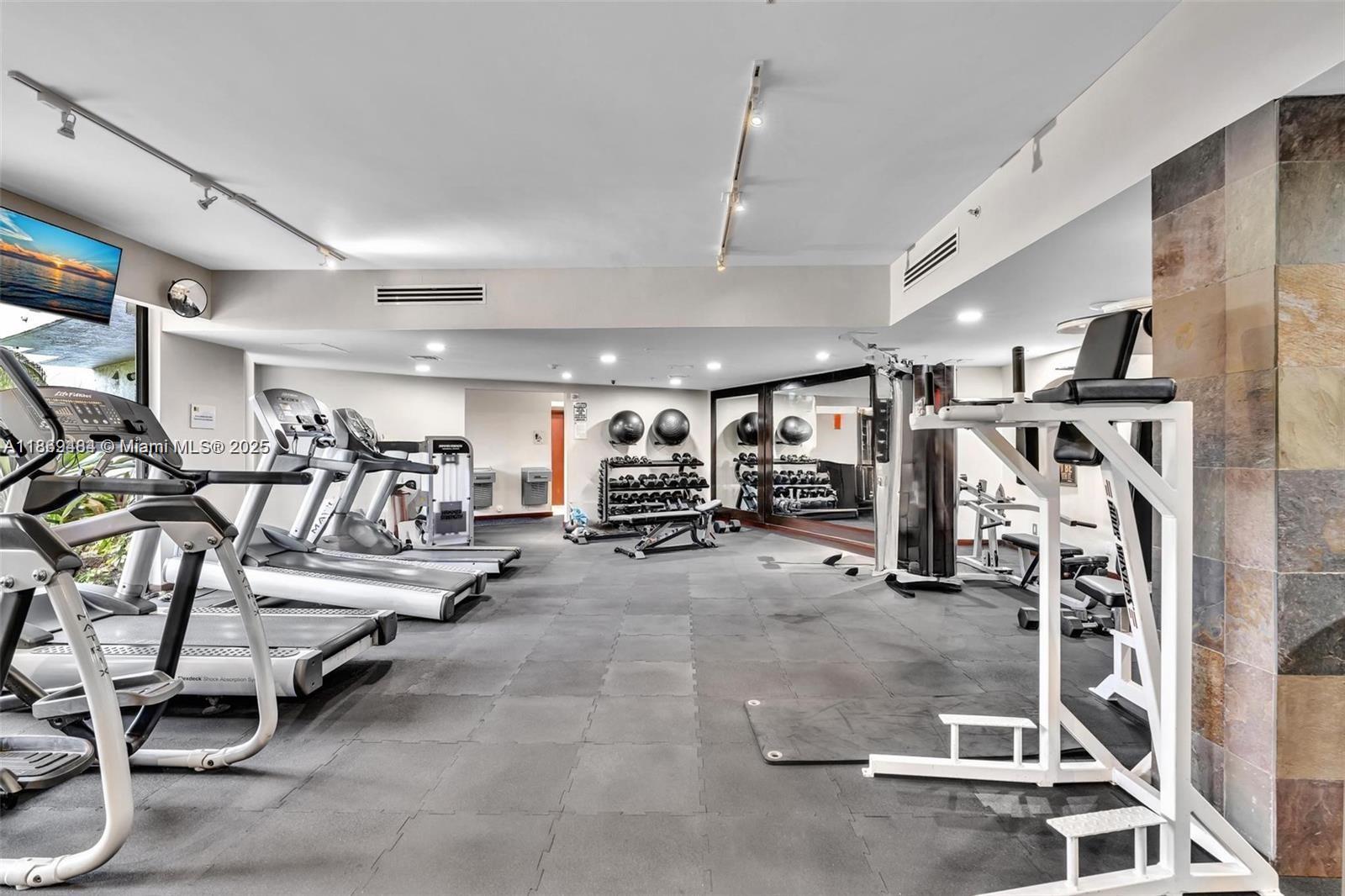 3300 Northeast 191st Street, Unit LP04 Aventura, FL 33180 - Photo 13 of 16 a view of a room with gym equipment