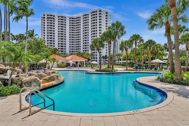 a view of a swimming pool with chairs