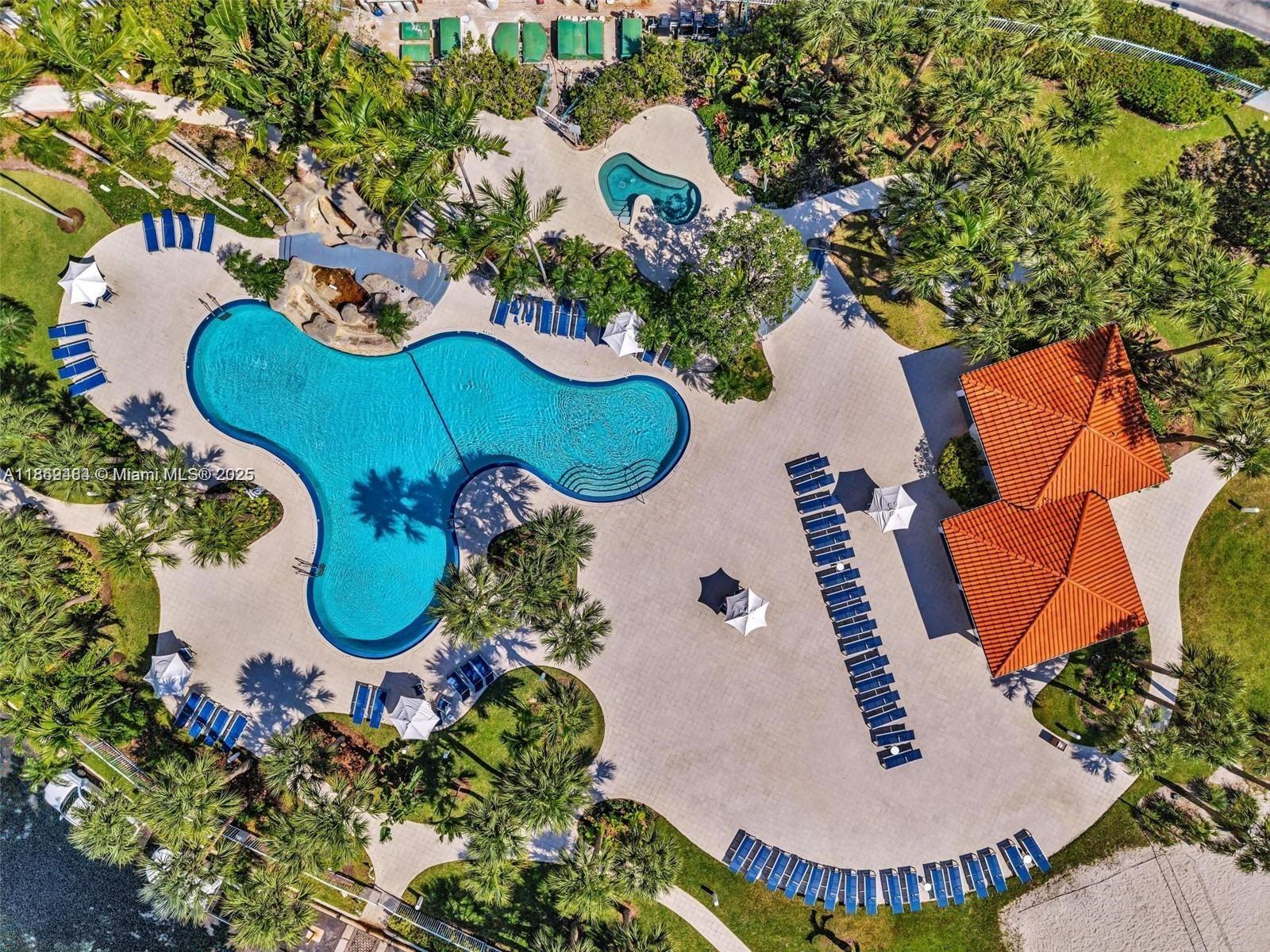 3300 Northeast 191st Street, Unit LP04 Aventura, FL 33180 - Photo 16 of 16 an aerial view of a house with swimming pool and outdoor seating