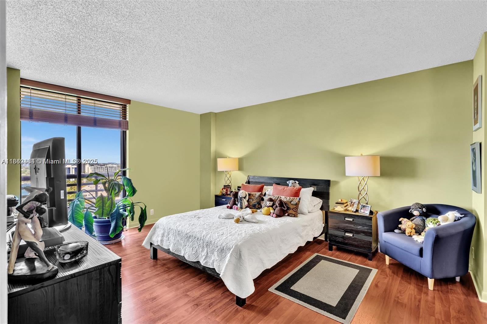 3300 Northeast 191st Street, Unit LP04 Aventura, FL 33180 - Photo 3 of 16 a bed room with a bed window and a couch