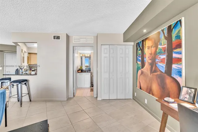 a view of a livingroom with furniture and windows