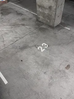 a view of a hallway with wooden floor and entryway