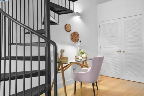 a bedroom with a bed and a lamp