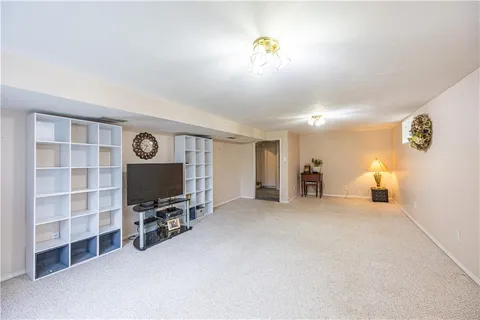 a view of a livingroom with furniture and a flat screen tv