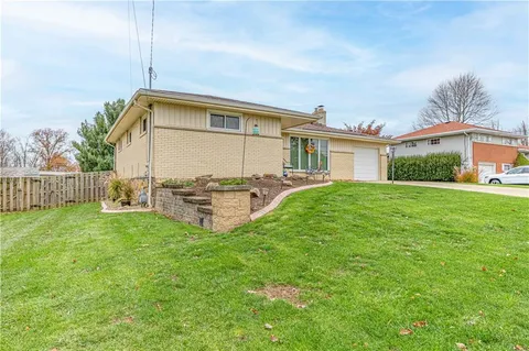 a view of a house with a back yard
