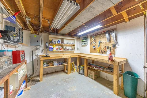 a utility room with stainless steel appliances and lots of cabinet