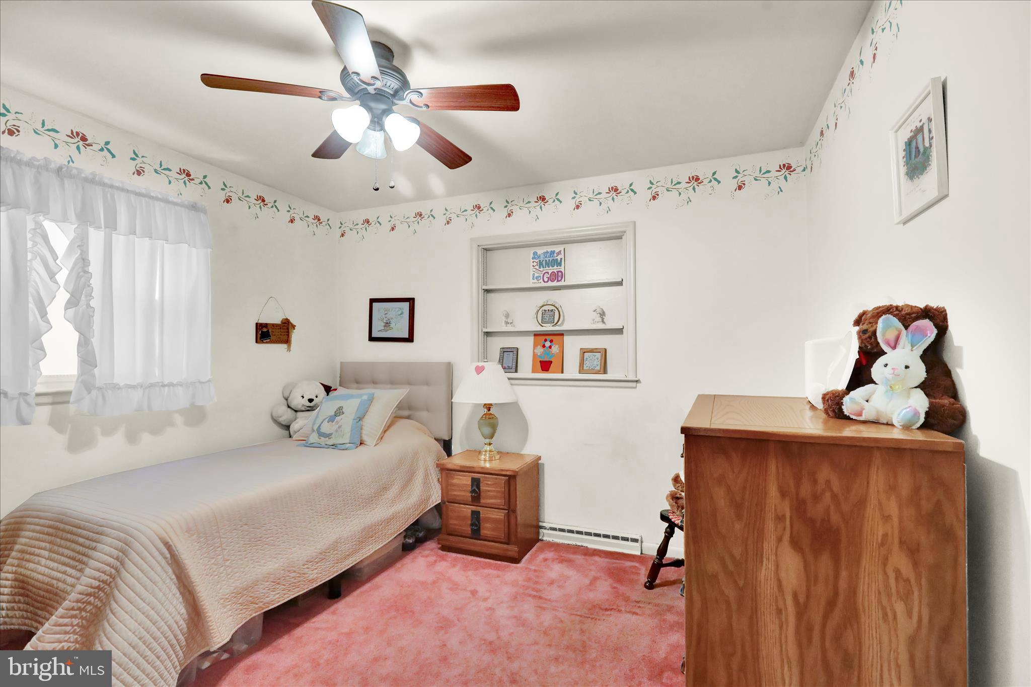 3029 Merritt Parkway Reading, PA 19608 - Photo 11 of 36 a bedroom with a bed and a chandelier