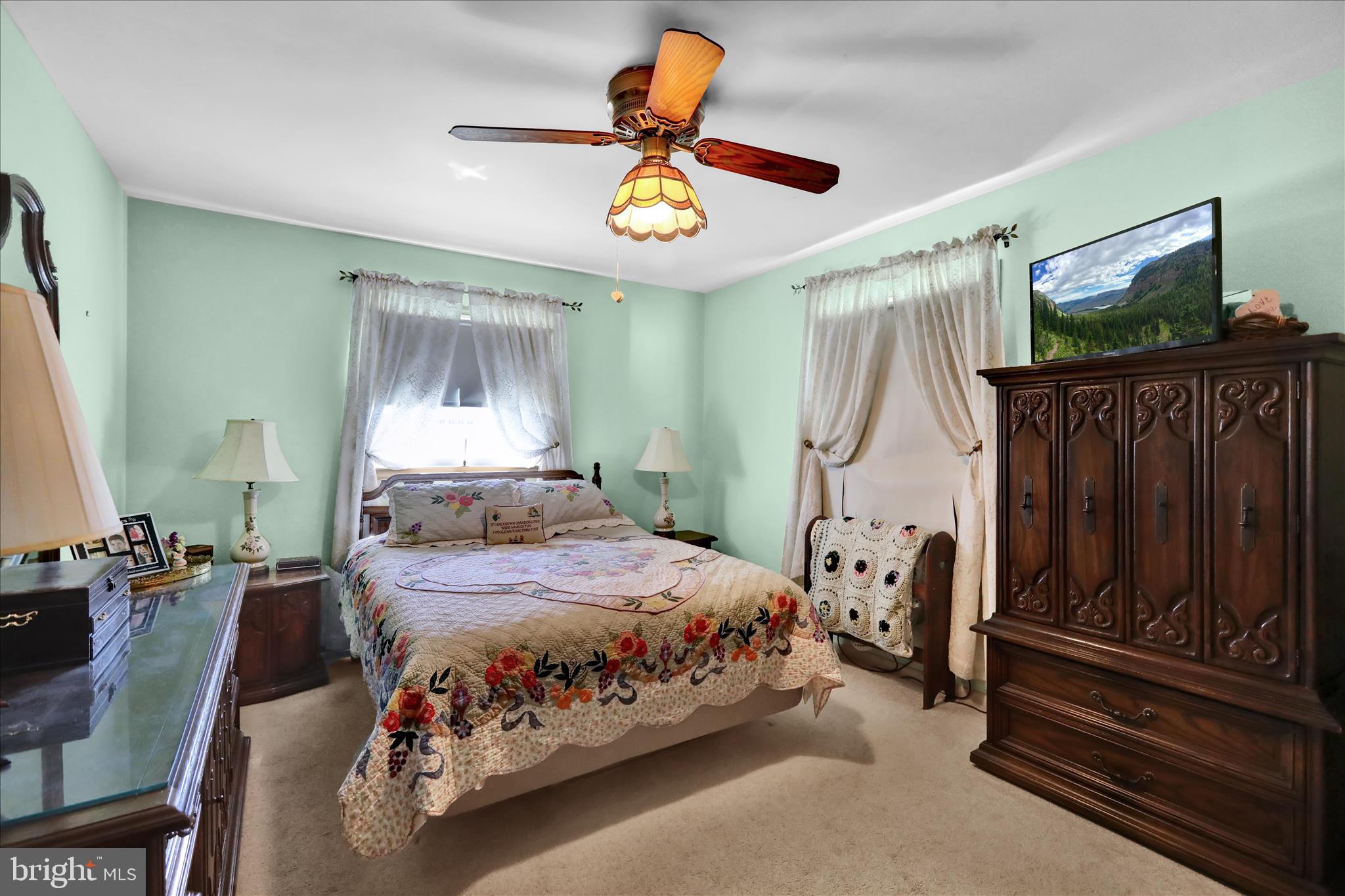3029 Merritt Parkway Reading, PA 19608 - Photo 13 of 36 a bedroom with a bed and a chandelier