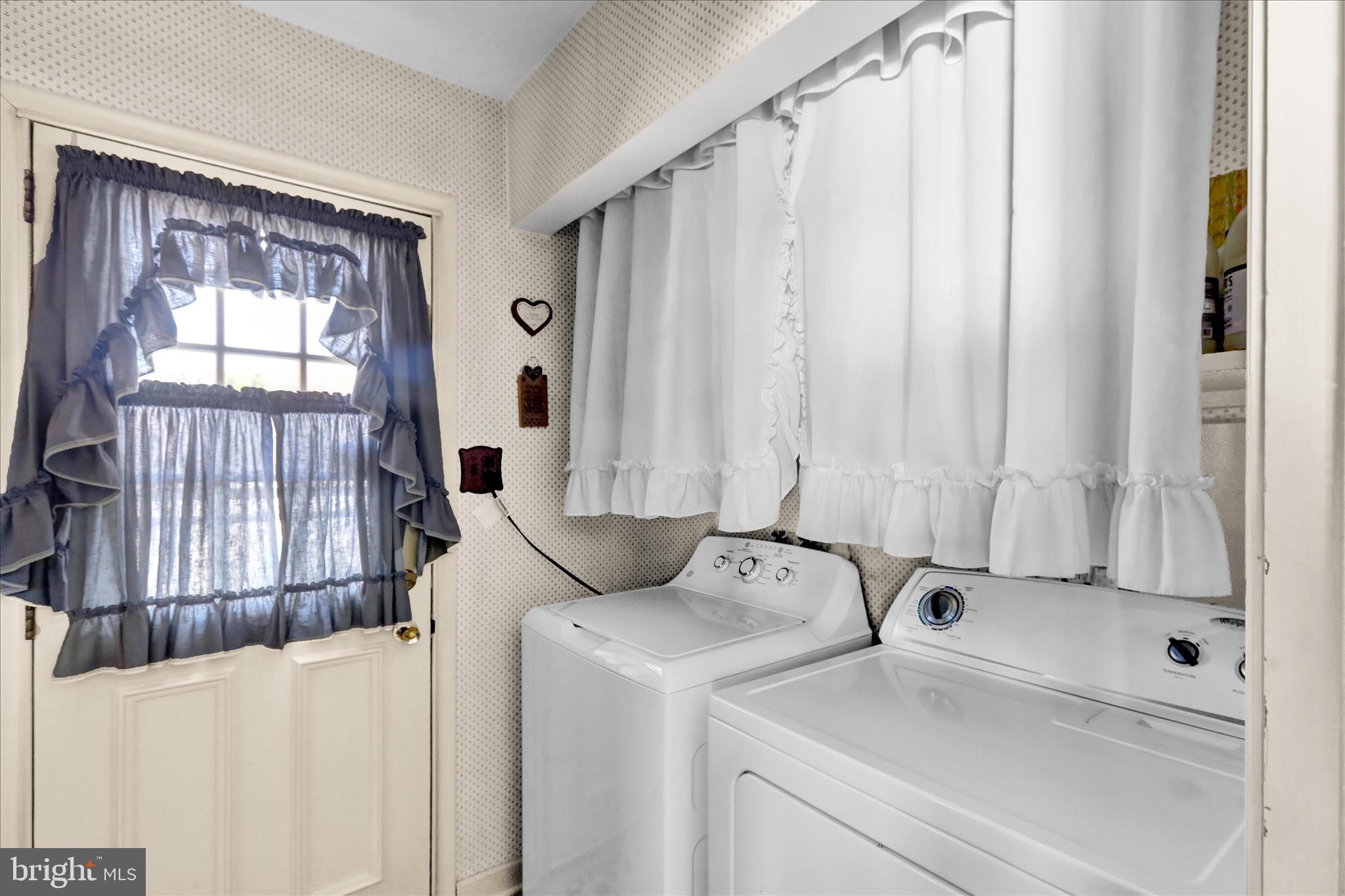 3029 Merritt Parkway Reading, PA 19608 - Photo 22 of 36 a view of washer and dryer with bathroom in the background