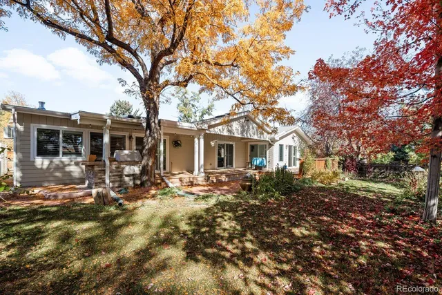 a front view of house with yard outdoor seating and barbeque oven