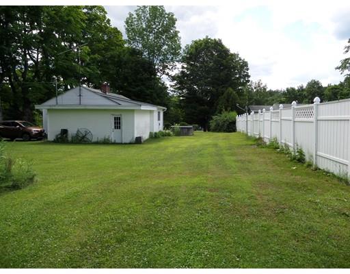 15 Sam Hill Road Worthington, MA 01098 - Photo 3 of 18 a white house with a big yard and large trees
