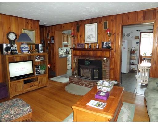 15 Sam Hill Road Worthington, MA 01098 - Photo 7 of 18 a living room with furniture a flat screen tv and a fireplace