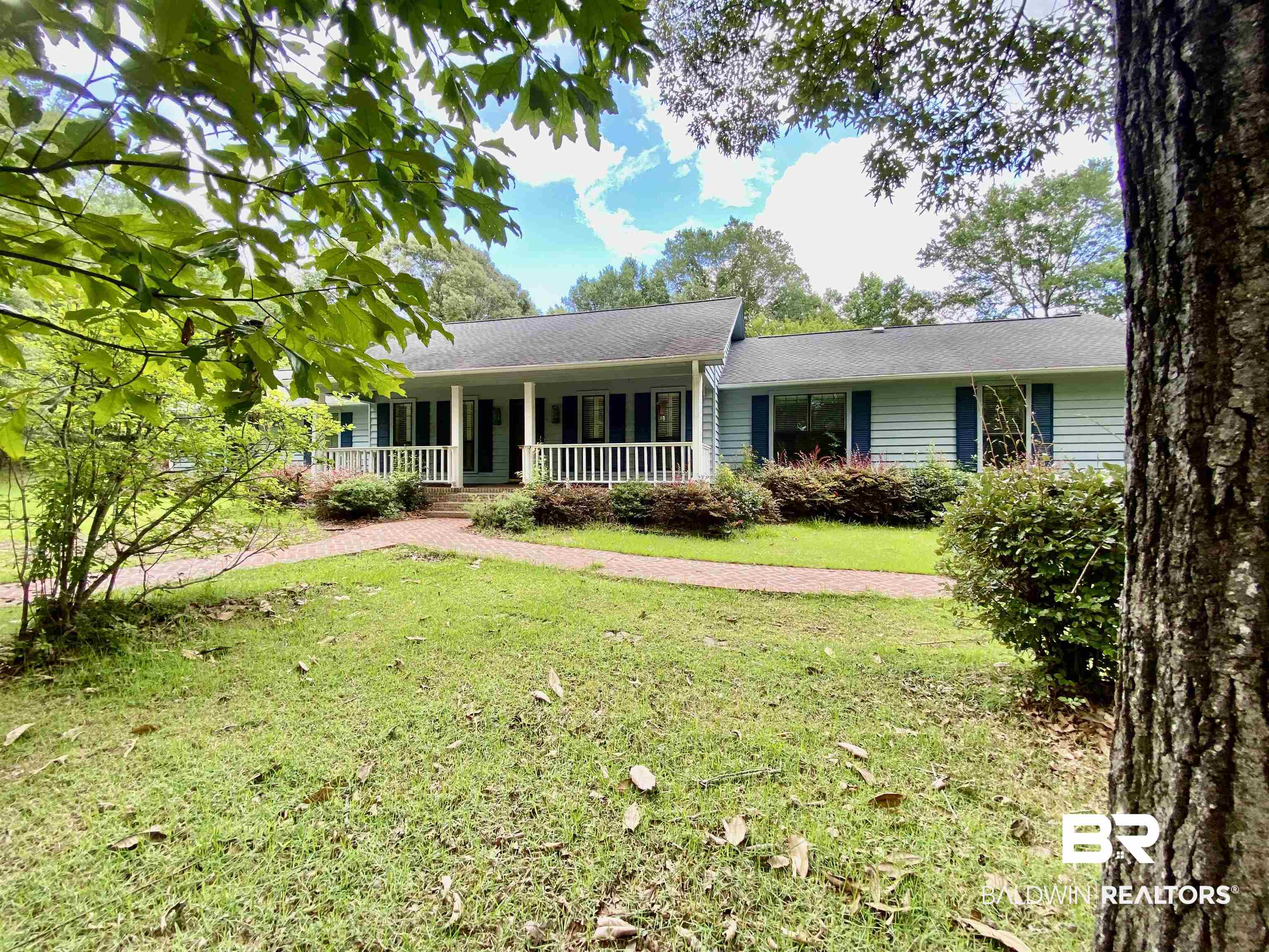 160 Mockingbird Lane Monroeville, AL 36460 - Photo 4 of 36 Ranch-style home featuring covered porch and a front lawn