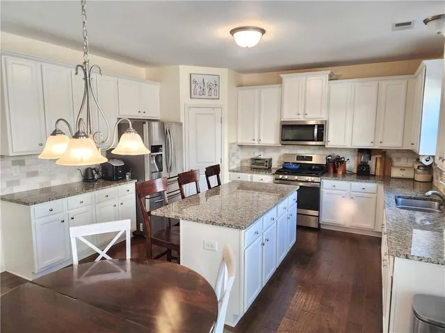 a view of swimming pool with outdoor seating