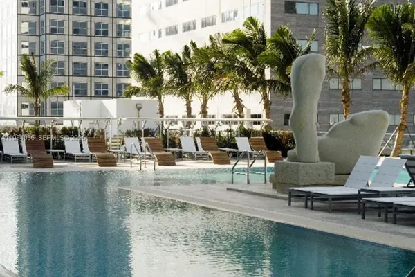 a view of a swimming pool with chairs