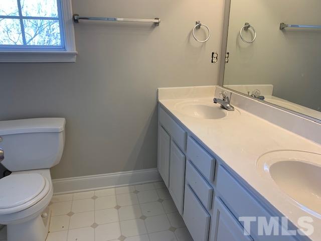 901 Ledgerock Road Wake Forest, NC 27587 - Photo 14 of 23 Master ensuite w/ dual vanity and soaking tub