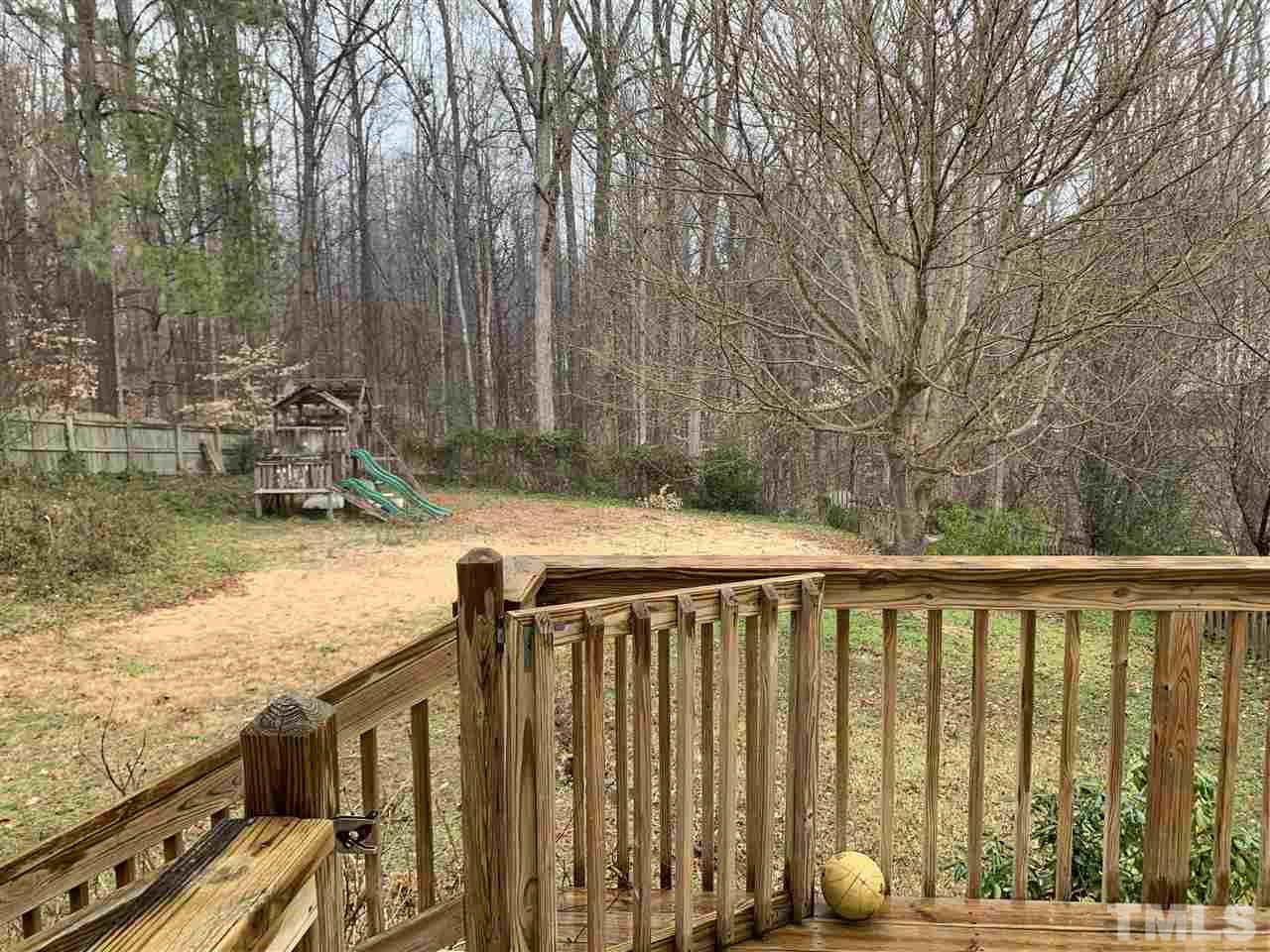 901 Ledgerock Road Wake Forest, NC 27587 - Photo 18 of 23 HUGE level backyard w/ playset & garden tiers